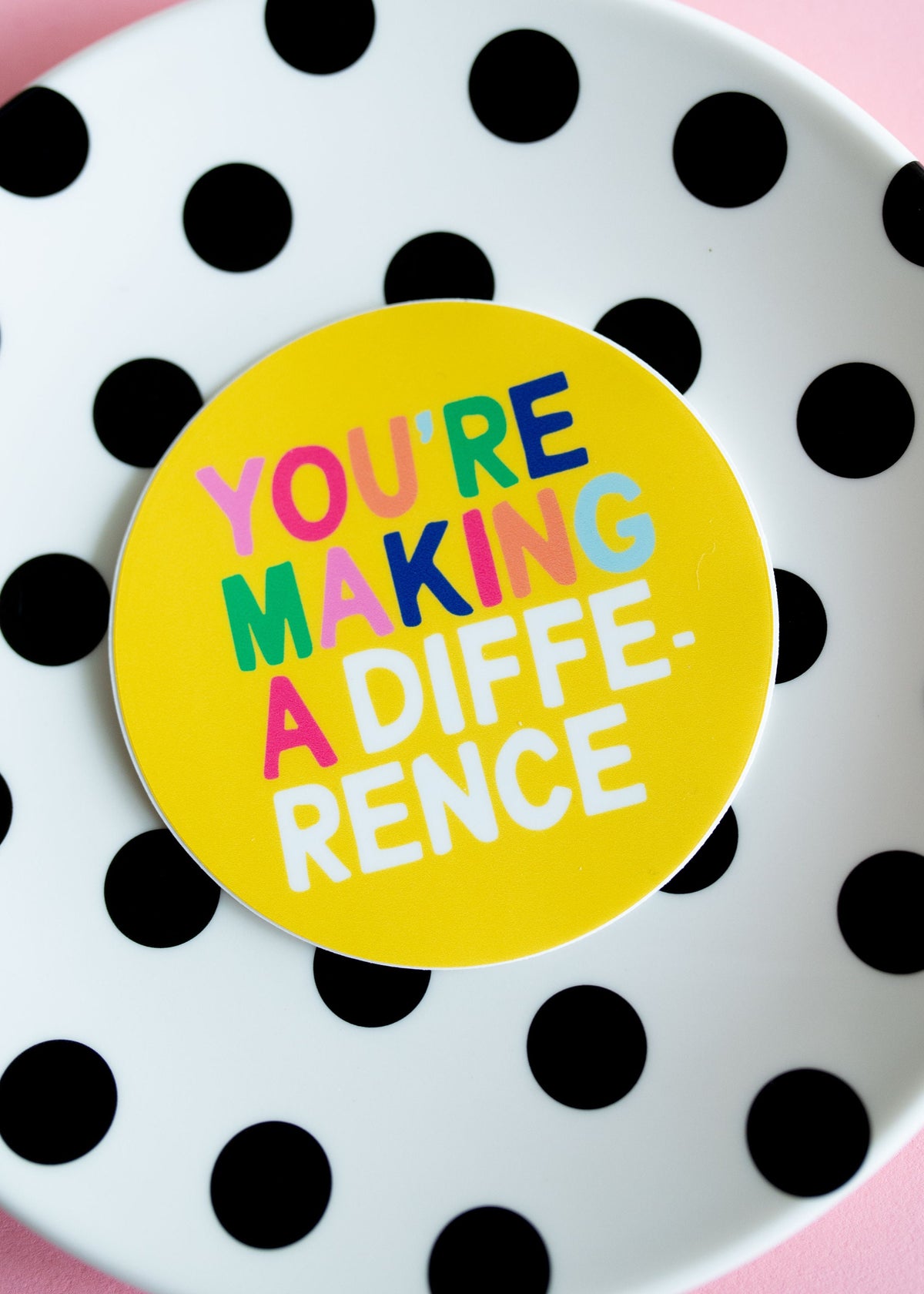 Round colorful sticker that reads you're making a difference.