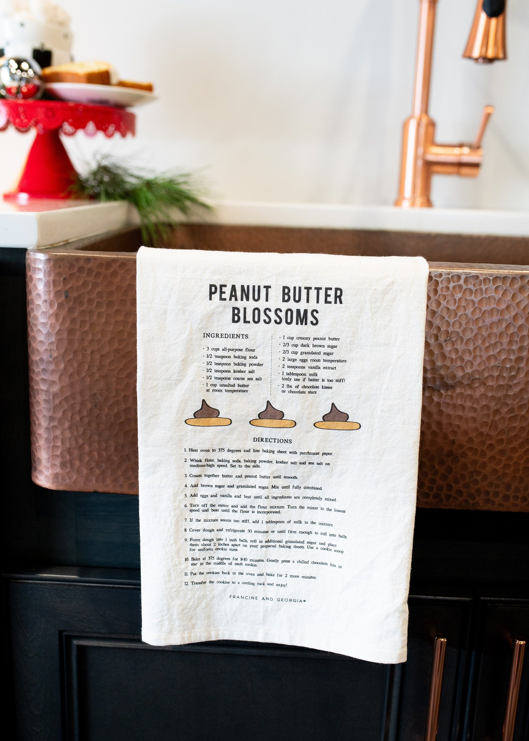Tea towel with a peanut butter blossoms cookie recipe.