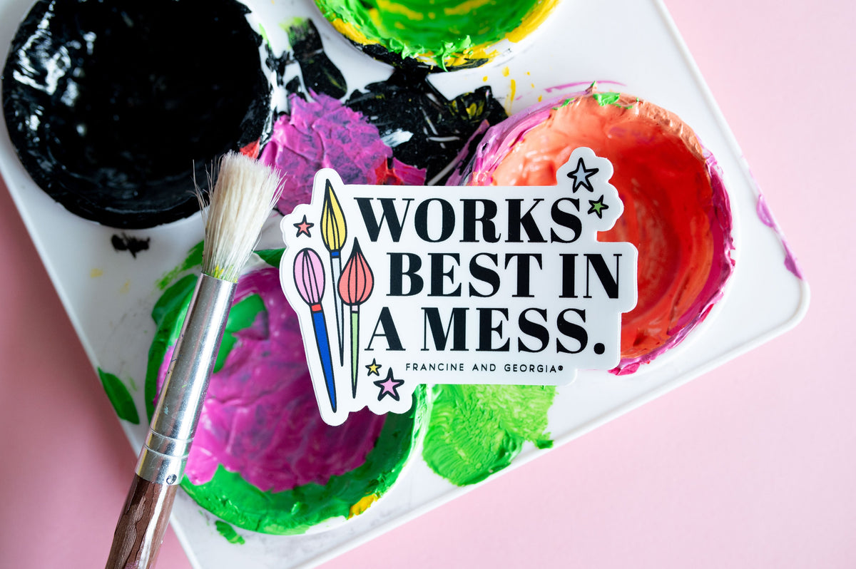 A sticker that reads works best in a mess lying on an artist's palette. 