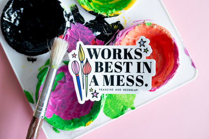 A sticker that reads works best in a mess lying on an artist's palette. 
