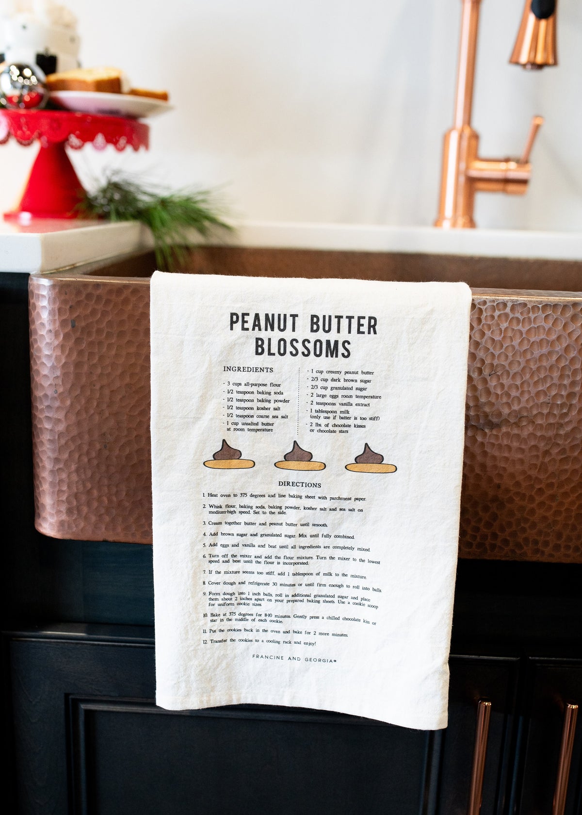 Tea towel with a peanut butter blossoms cookie recipe.