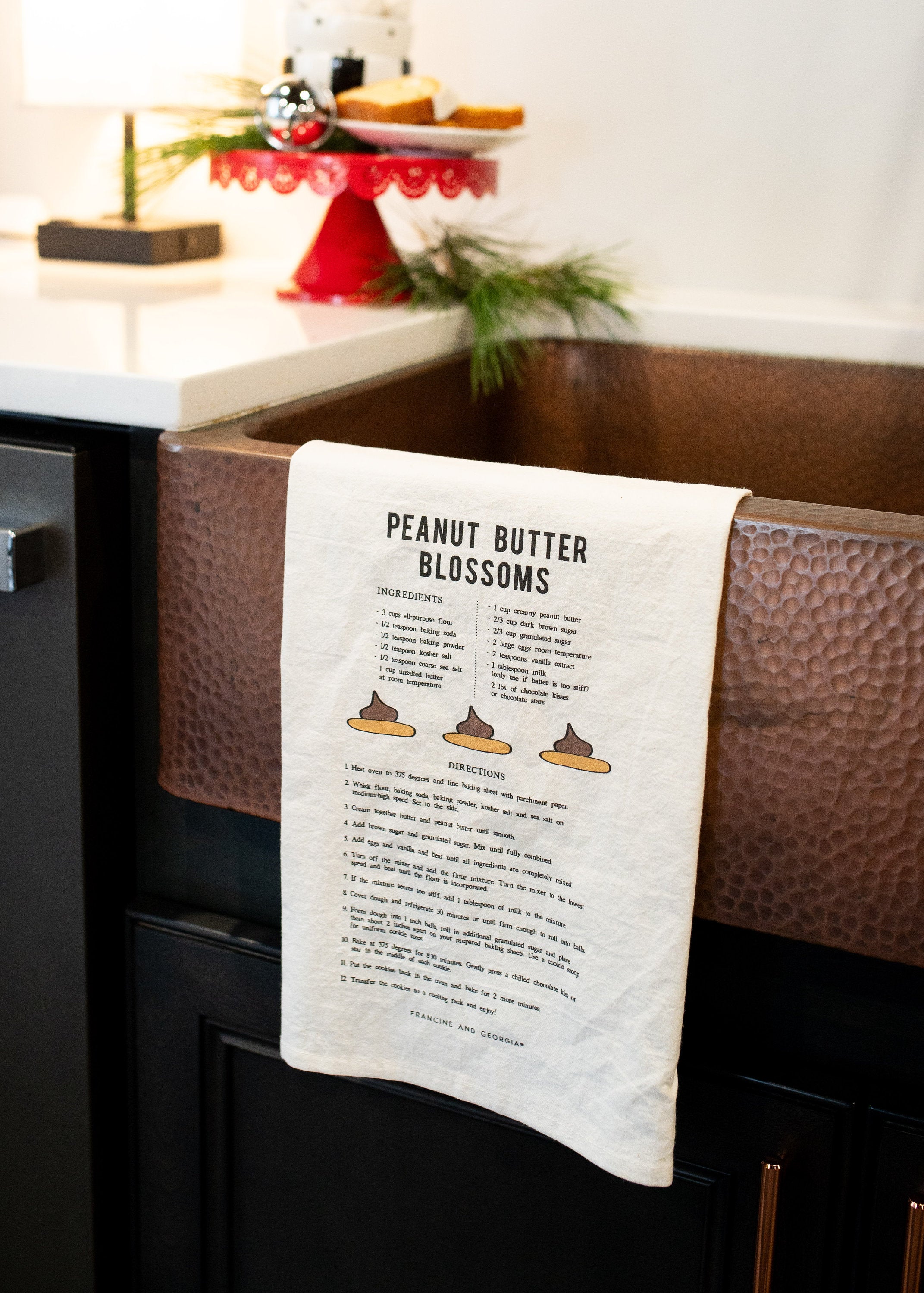 White tea towel with a cookie recipe on it.