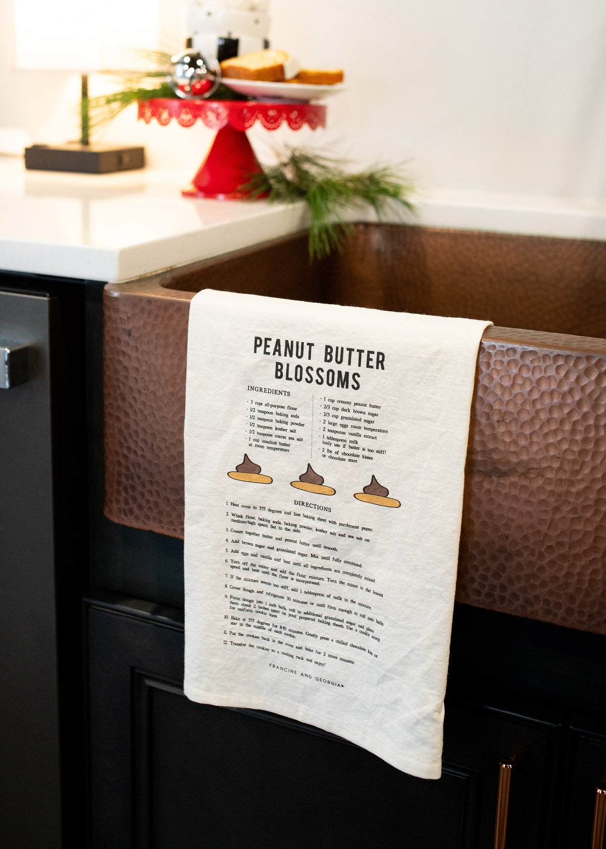 White tea towel with a cookie recipe on it.