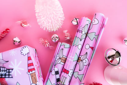 Rolls of pink Santa gift wrap.
